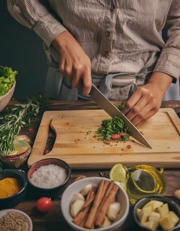 The,Chef,Is,Chopping,Fresh,Vegetables,On,A,Rustic,Table.
